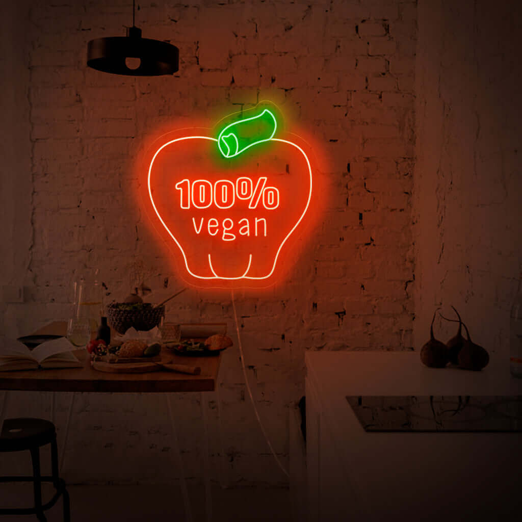 "100% Vegan With Apple Neon Sign" on eloisa ja ympäristöystävällinen muotoilu, joka ylpeänä esittelee omenasymbolia osoituksena sitoutumisestasi kasviperäiseen elämäntapaan.