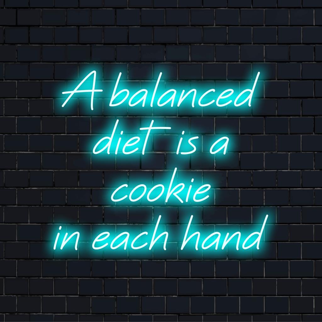 Mukautettu LED-neonkyltti, jossa on humoristinen tasapainolainaus keksistä molemmissa käsissä, täydellinen omituiseen seinätaiteen sisustukseen.