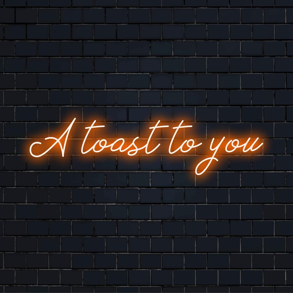 Mukautettu LED-neonkyltti, jossa on ilmaus A Toast To You eloisissa väreissä, ja se on täydellinen lisäämään juhlallista tunnelmaa mihin tahansa tilaan.