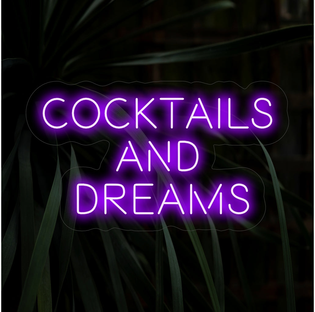 "Cocktails And Dreams Neon Sign" ��� Trendikäs ja henkinen neonvalo, jossa on sanat "Cocktails And Dreams", joka luo baariisi tai viihdealueellesi tyylikkään ja hauskan tunnelman.