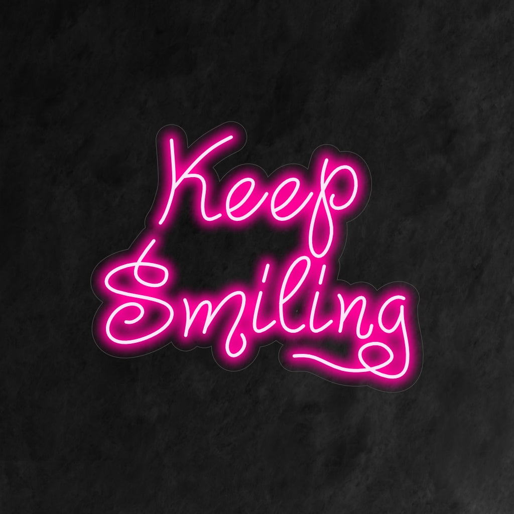 "Keep Smiling Neon Sign" on motivoiva ja positiivinen lisä sisustukseen. Neonvalo, joka toimii päivittäisenä muistutuksena ylläpitää iloista asennetta.