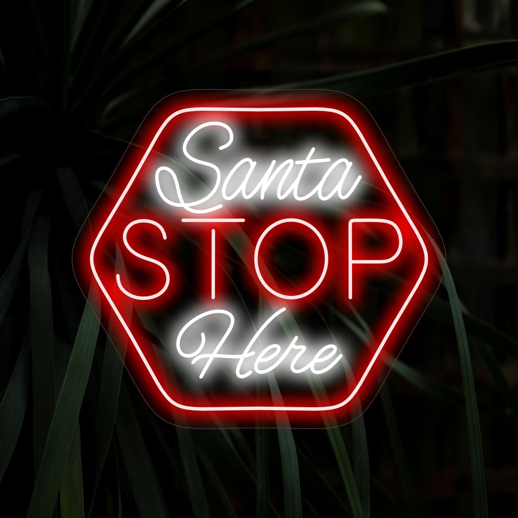 "Stop Santa Here Neon Sign" tuo leikkisällä viestillään joulun oikkua, loistaa lämmintä hehkua ja luo iloisen tunnelman lomasi sisustukseen.