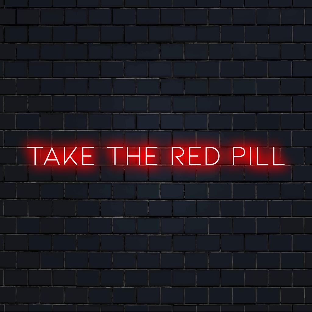 LED-valokyltti, jossa on sana Take The Red Pill kirkkaassa, katseenvangitsijassa valossa. Täydellinen moderniin seinän sisustukseen.