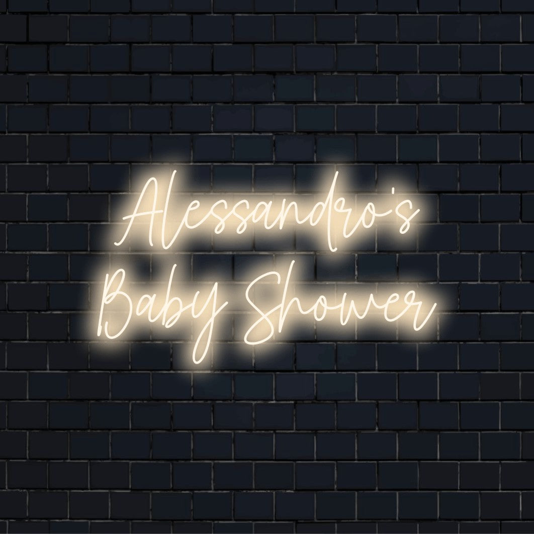 Alessandro_s Baby Shower Personalized LED Neon Sign, glowing neon text on black brick background