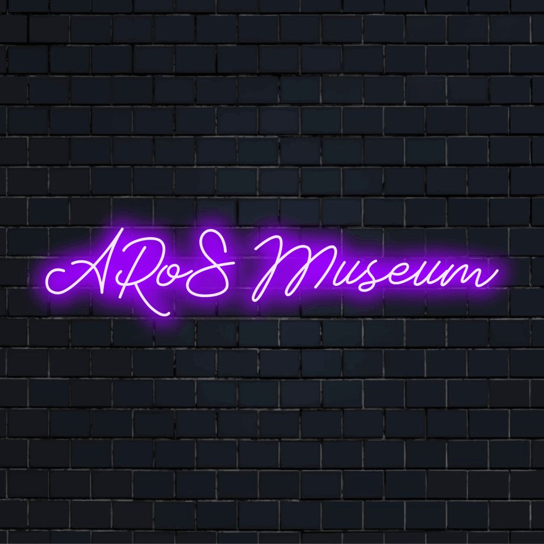 Aros Museum Neon Sign, glowing lettering on black brick background