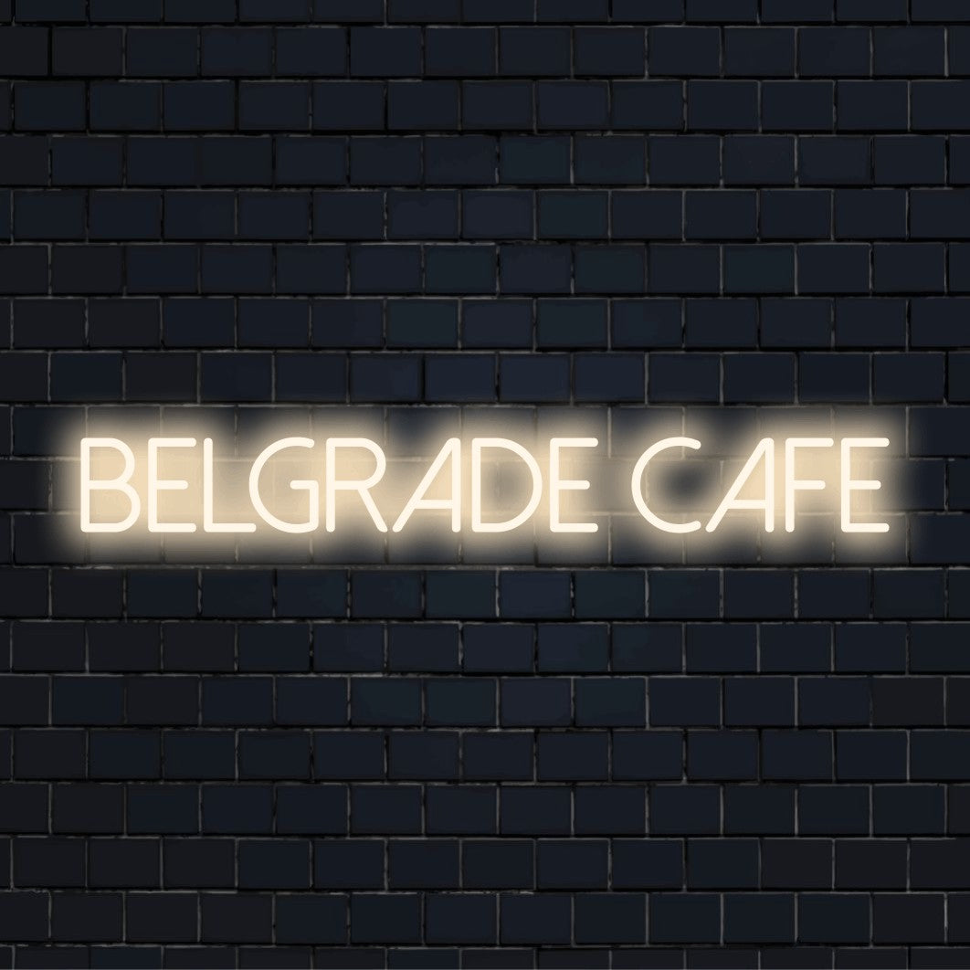 Belgrade Cafe Neon Light with glowing wall decor against black brick wall