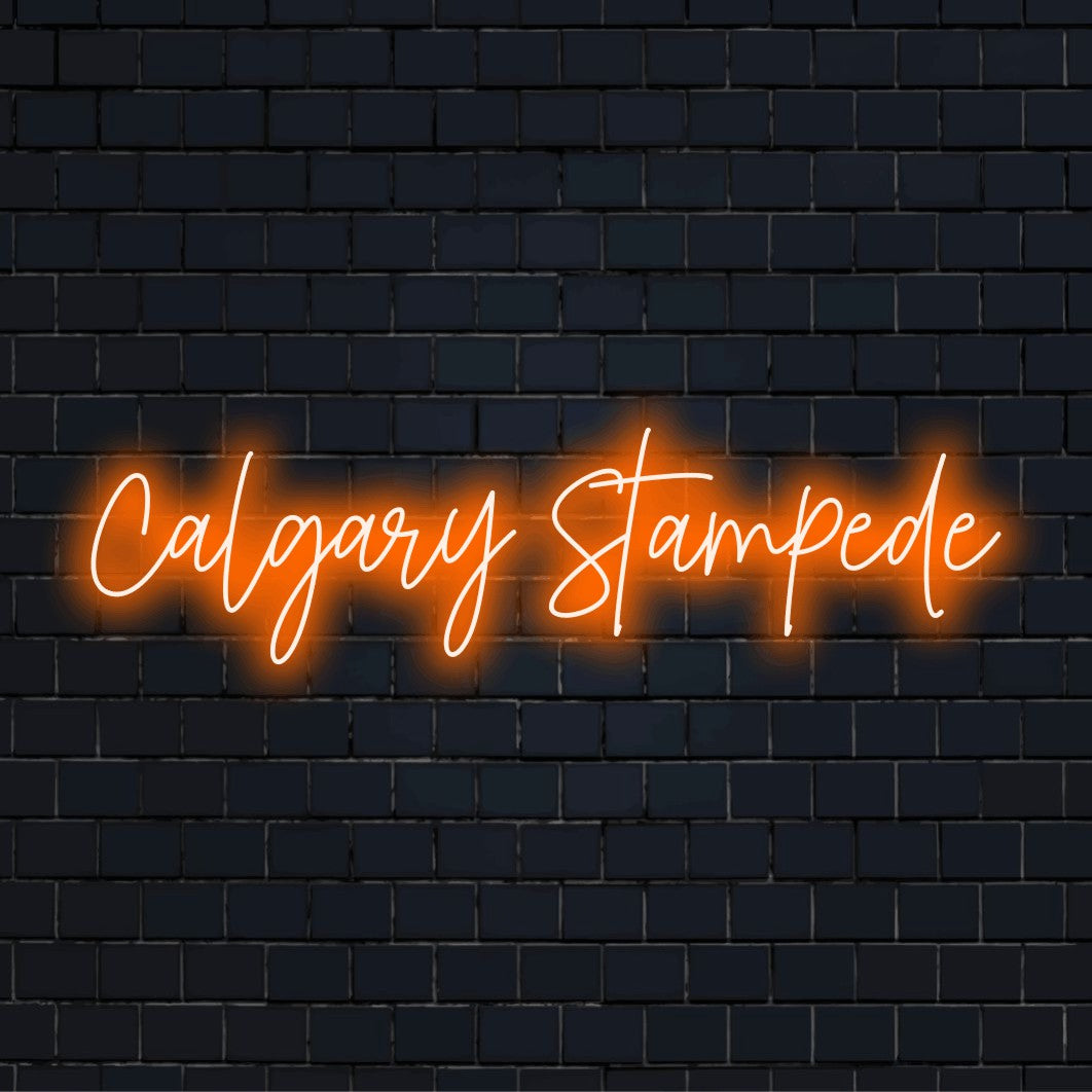 Calgary Stampede LED Neon Sign, soft neon glow on dark brick wall