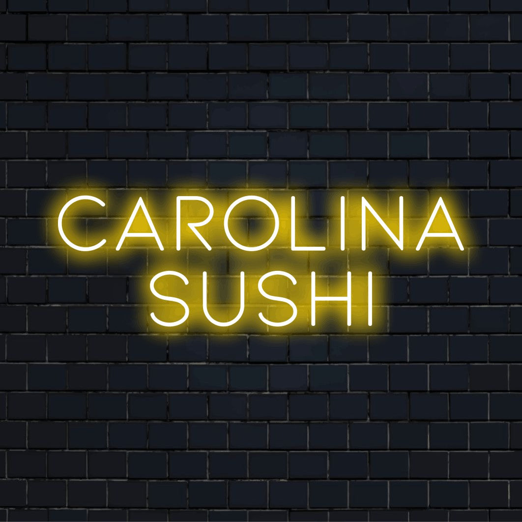 Carolina Sushi Custom Name Neon Sign, neon text light against brick backdrop