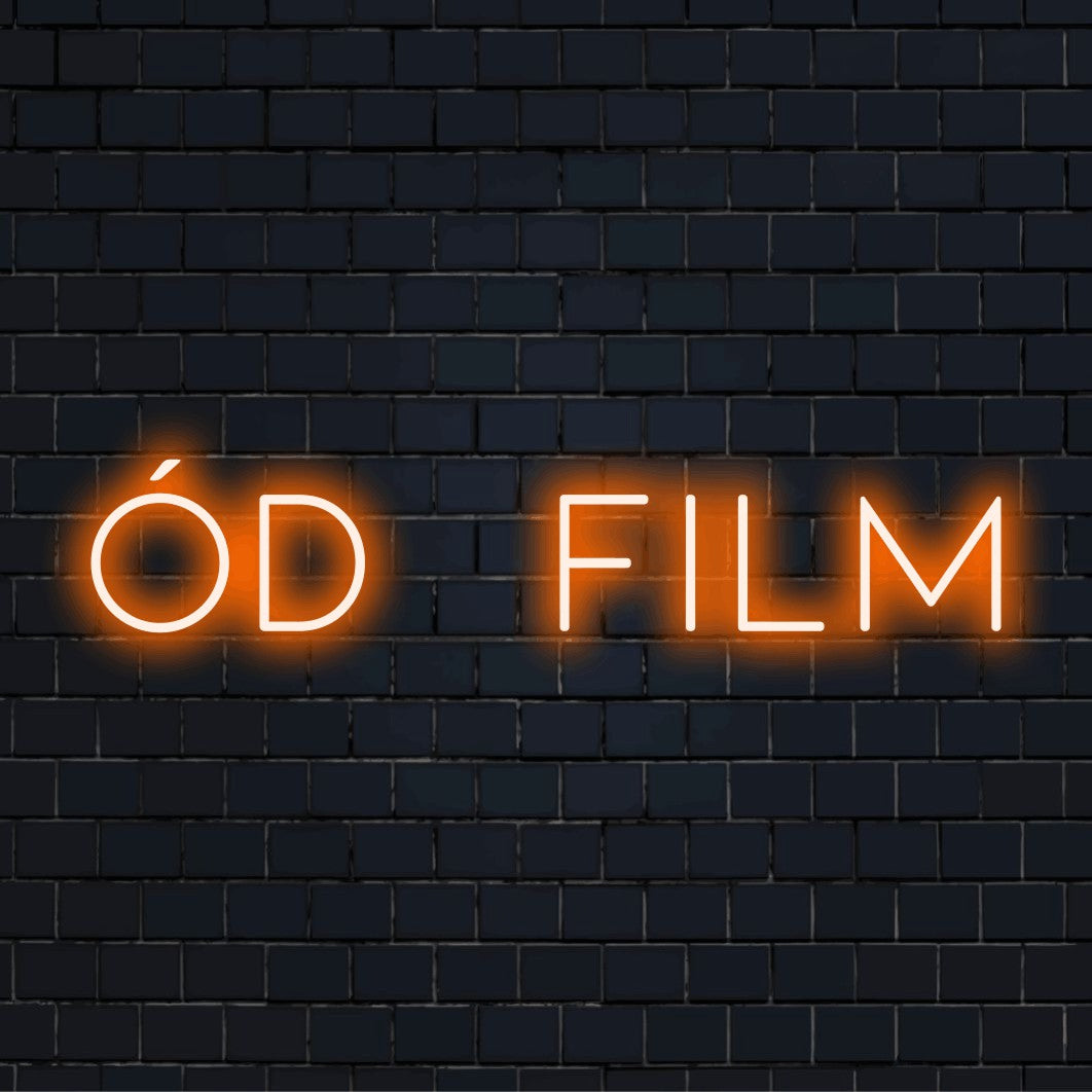D Film Neon Sign, glowing wall decor against brick backdrop