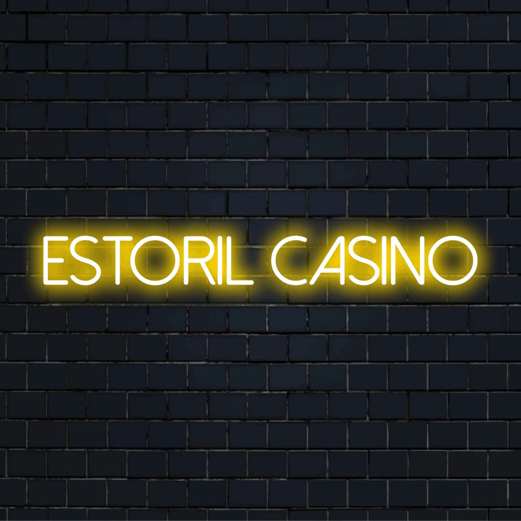Estoril Casino Neon Light with neon text light against black brick wall