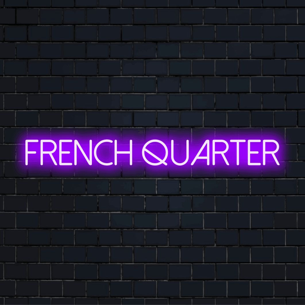 French Quarter Neon Light with glowing wall decor against black brick wall