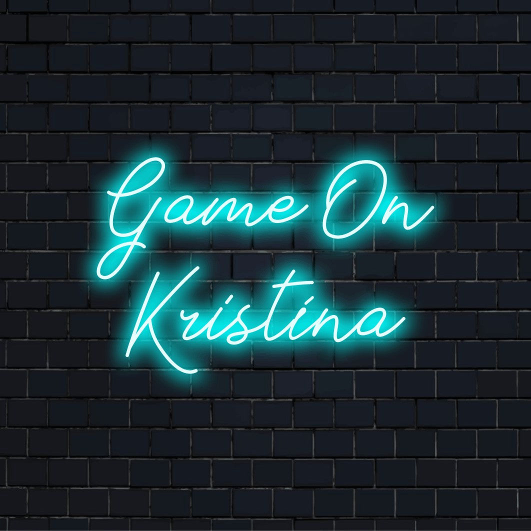 Game On Kristina Custom Name Neon Sign, glowing lettering on black brick background