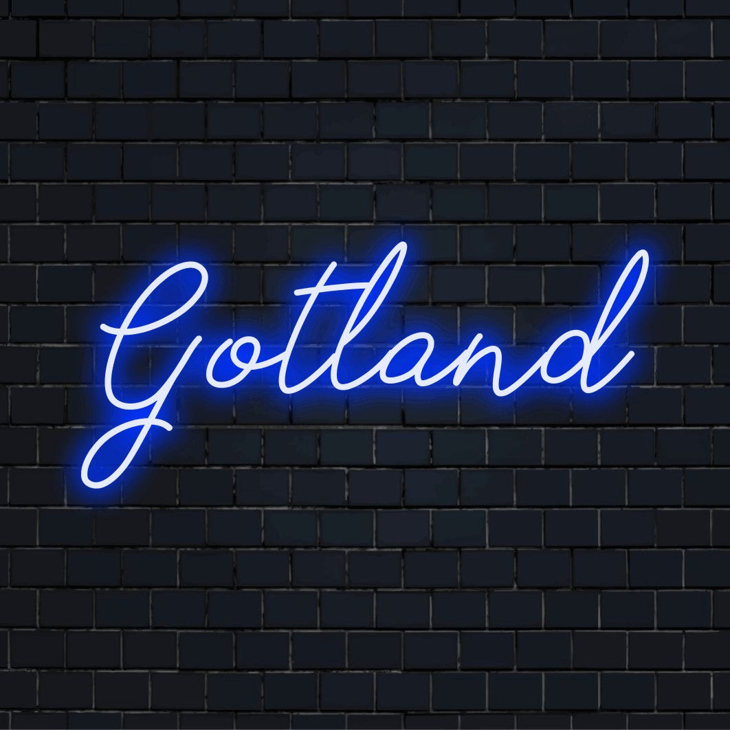 Gotland LED Neon Sign, neon text light on black brick background