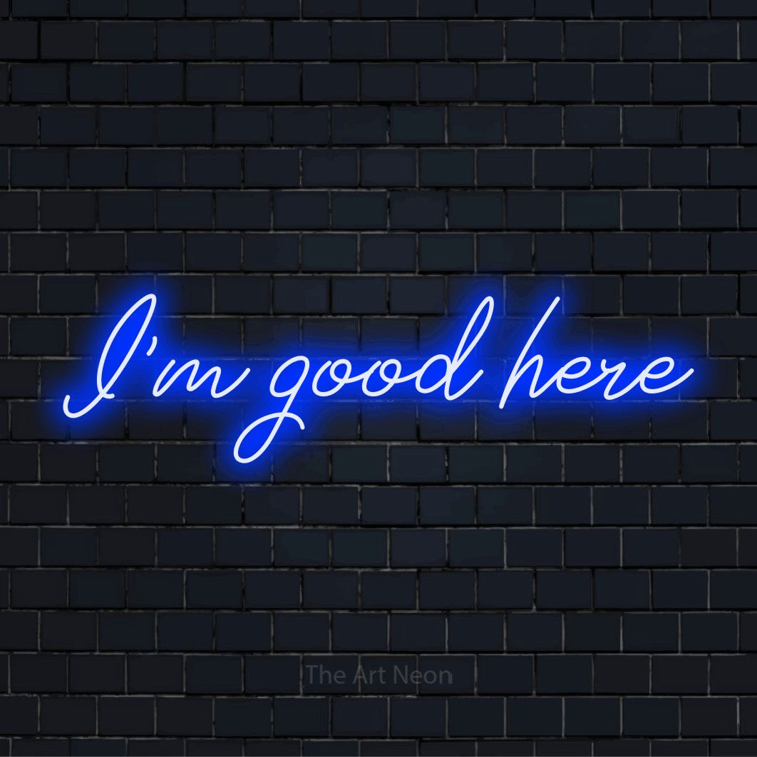 "I’m Good Here" glowing LED neon sign on a black brick wall