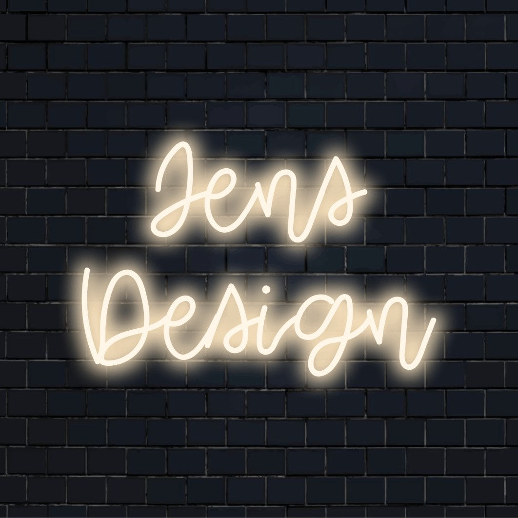 Jens Design Custom Name Neon Sign, glowing neon text on dark brick wall