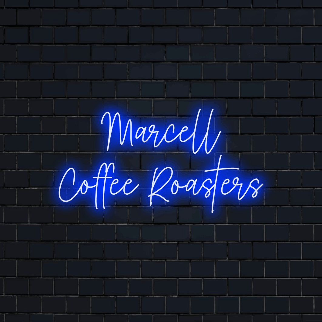 Marcell Coffee Roasters Custom Name Neon Sign, neon text light against brick backdrop