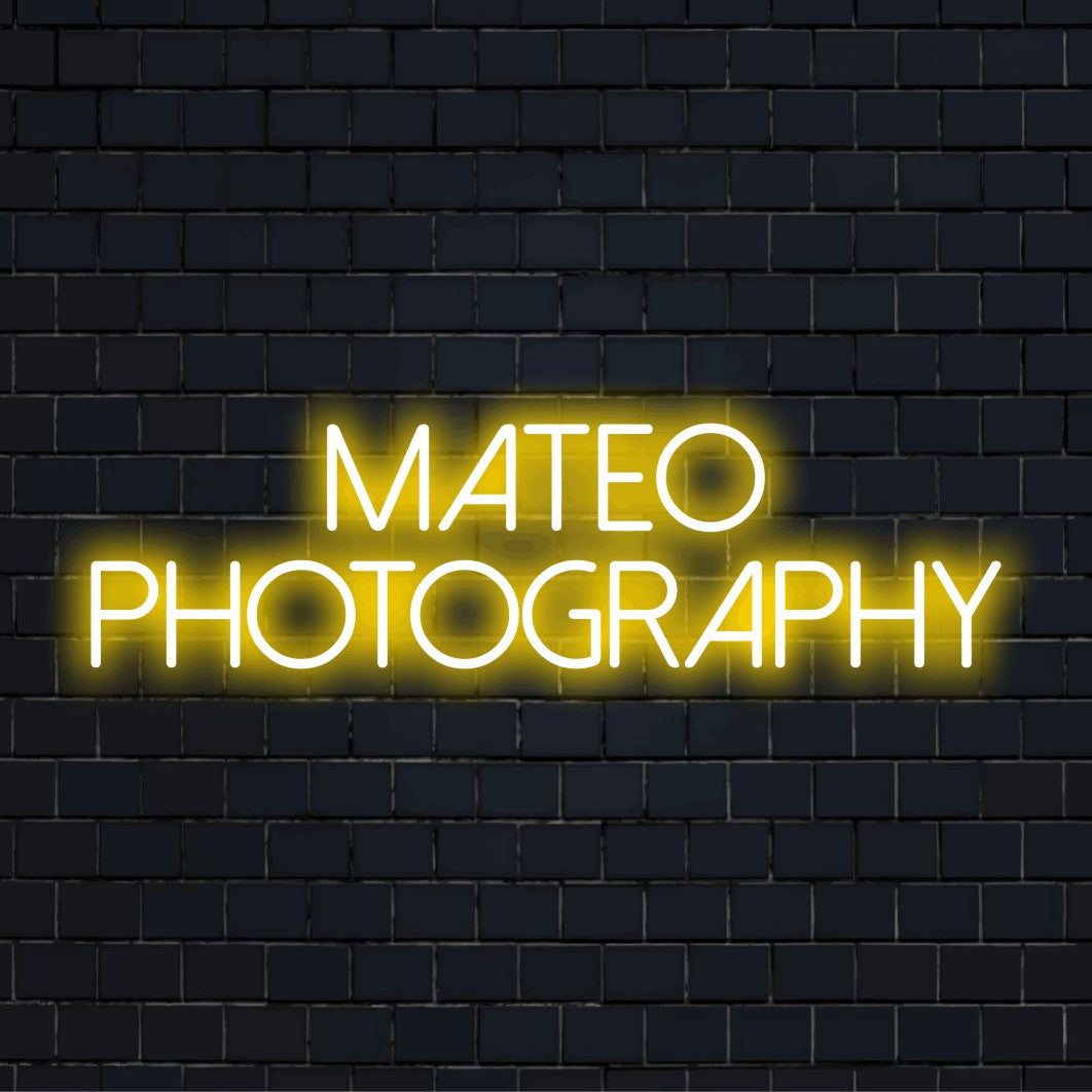 Mateo Photography Custom Name Neon Sign, bright neon lettering on black brick background