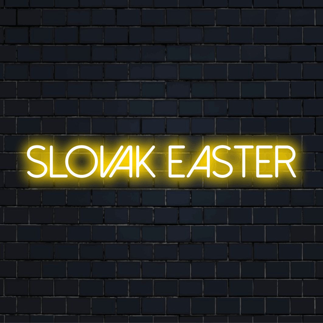 Slovak Easter Neon Light with neon text light against black brick wall