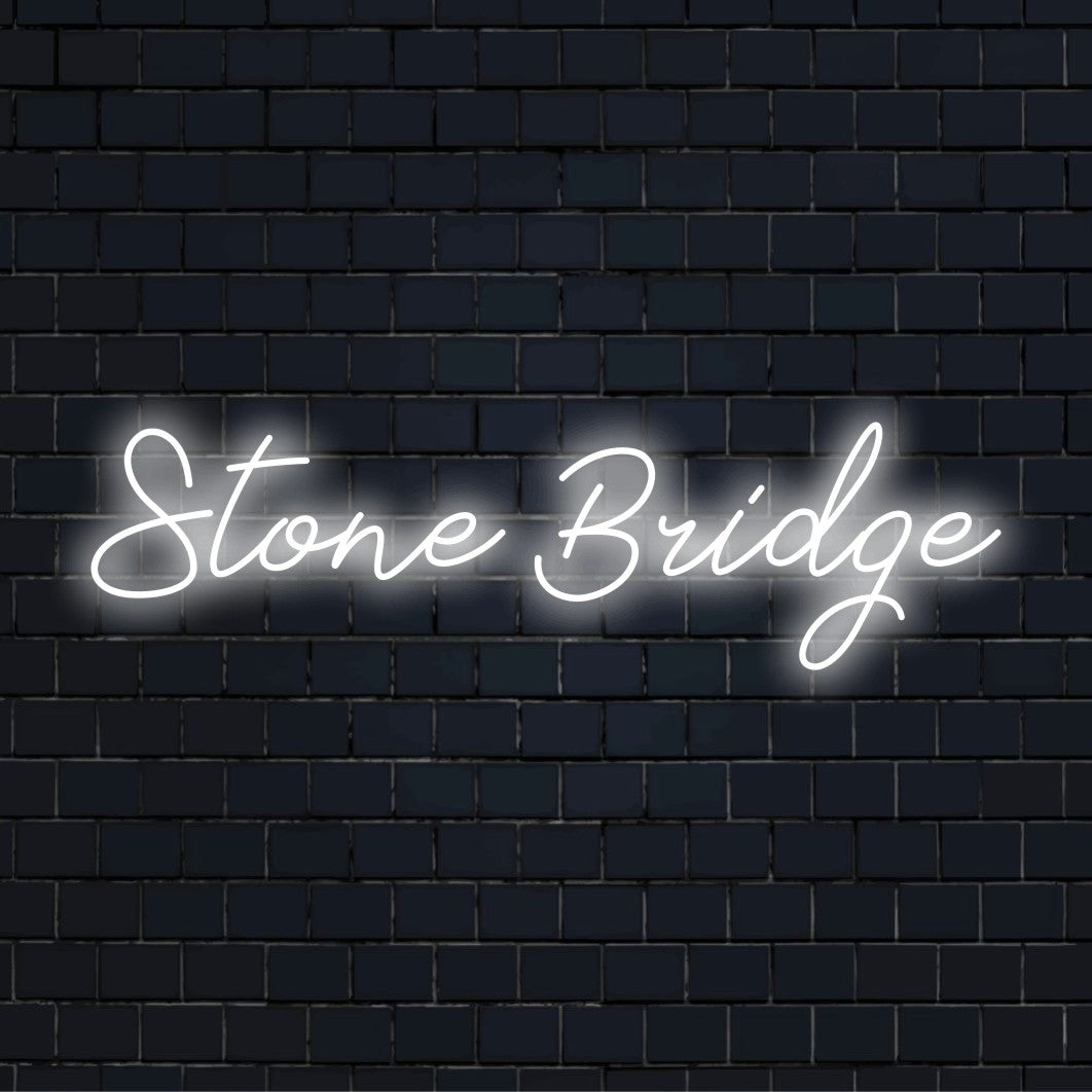 Stone Bridge Neon Sign, glowing neon text on dark brick wall