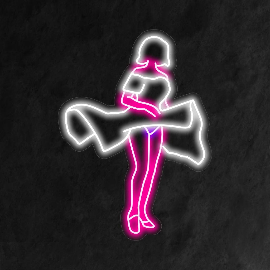 Kiehtova vintage-neonkyltti, jossa on nainen pitkässä mekossa, jonka hame on kauniisti tuulen nostamassa.