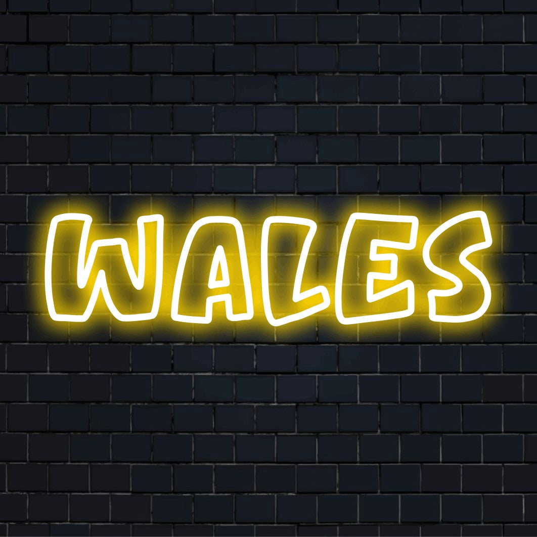 Wales Neon Sign, bright neon glow on black brick background