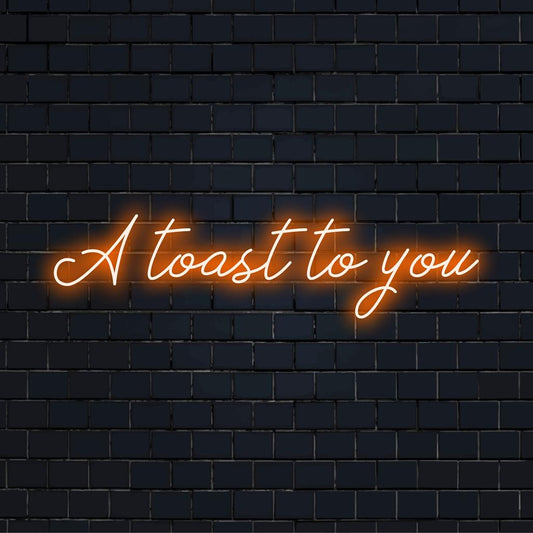 Mukautettu LED-neonkyltti, jossa on ilmaus A Toast To You eloisissa väreissä, ja se on täydellinen lisäämään juhlallista tunnelmaa mihin tahansa tilaan.