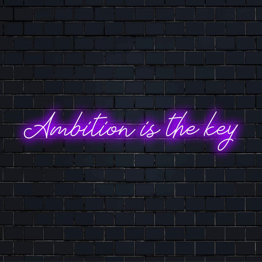 Mittatilaustyönä valmistettu LED-valokyltti, jossa näkyy Ambition Is The Key eloisissa väreissä, täydellinen yksilölliseen sisustukseen.
