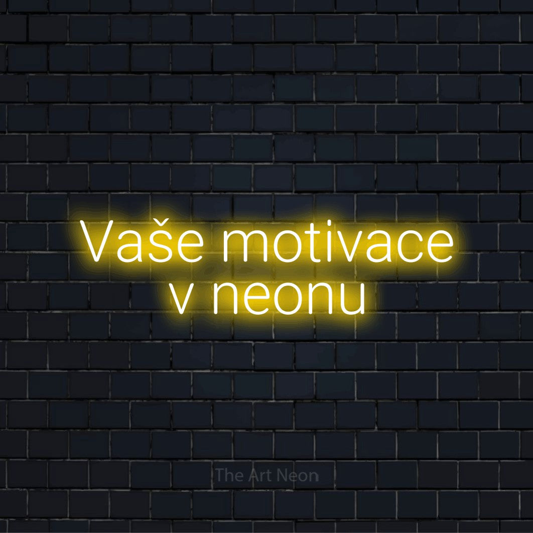 Neonový nápis na míru „Vaše motivace v neonu“ na černé cihlové zdi