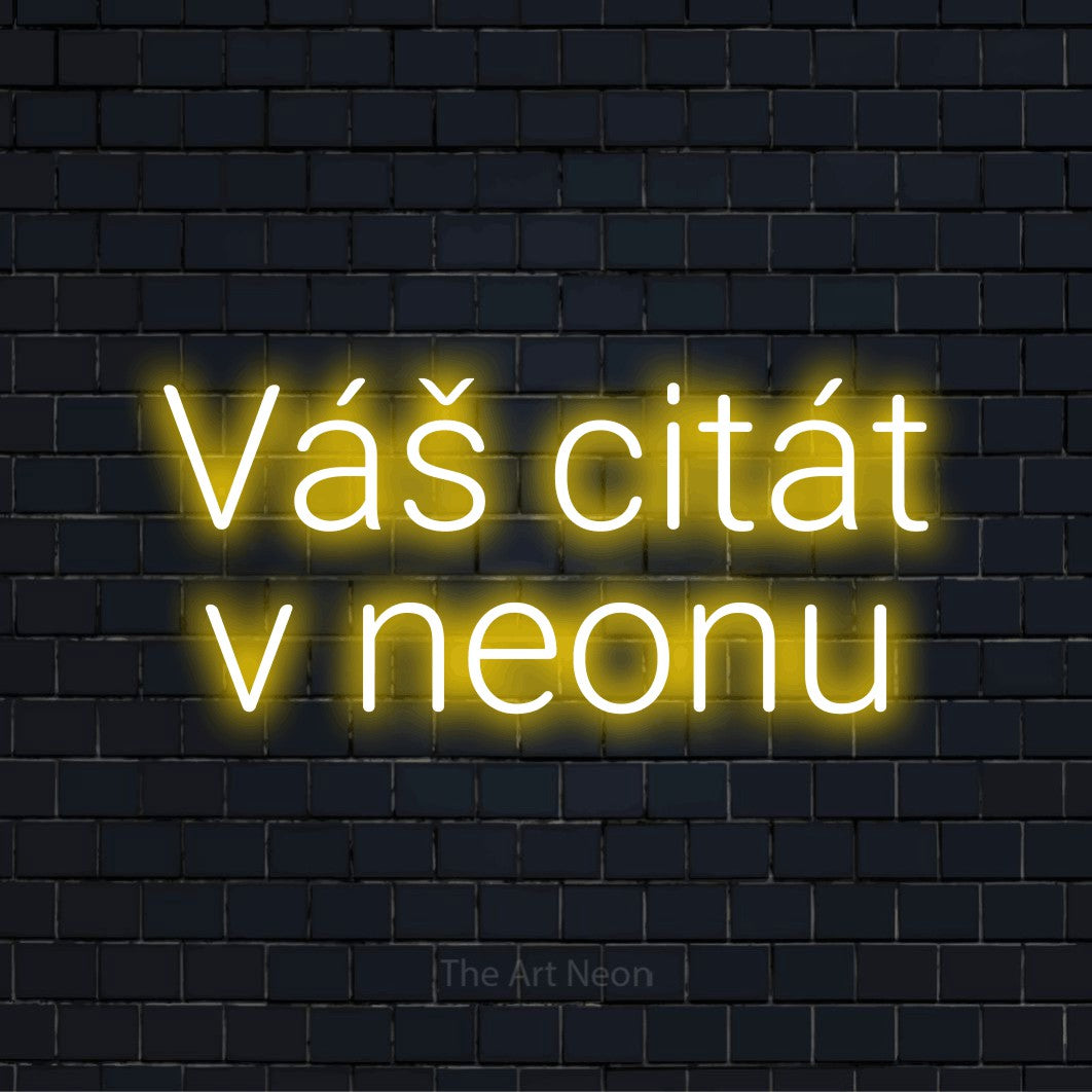 Neonový nápis na míru „Váš citát v neonu“ na černé cihlové zdi