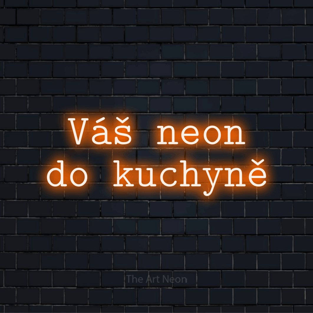 Neonový nápis na míru „Váš neon do kuchyně“ na černé cihlové zdi