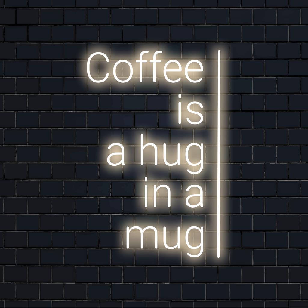 Mukautettu LED-kyltti, jossa näkyy Coffee Is A Hug In A Mug kirkkaan neonvärisenä; täydellinen kodikkaan kodin tai kahvilan sisustukseen.