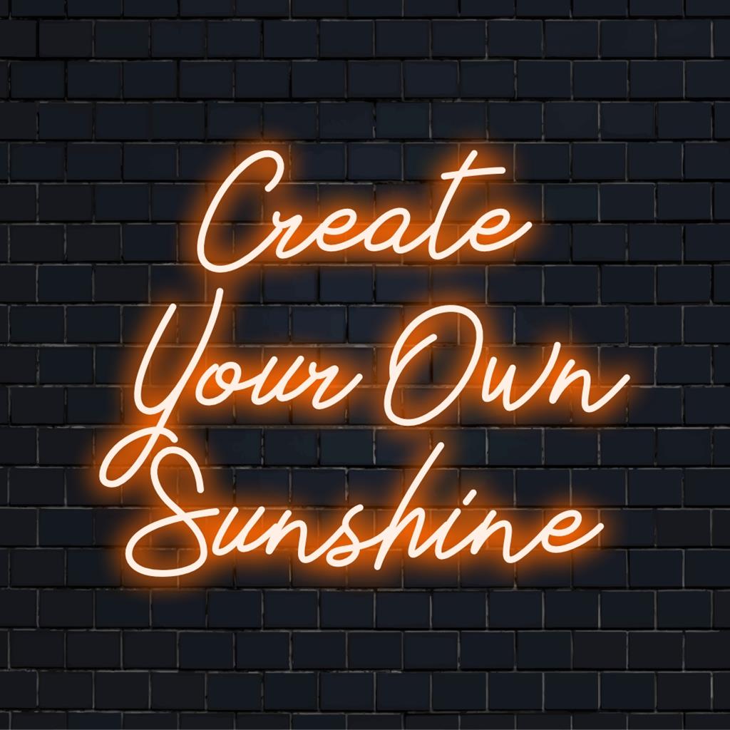 Värikäs LED-valokyltti sanoilla Create Your Own Sunshine; täydellinen neonseinätaide ja mukautettu vaalea sisustusominaisuus.