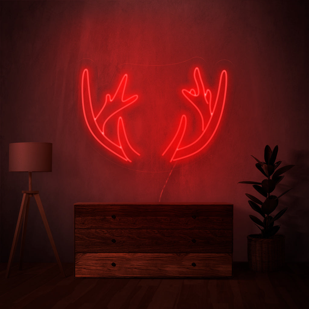 "Deer Horns Neon Sign" lights up with a rustic glow, bringing the untamed beauty of the outdoors into your space, perfect for nature enthusiasts and rustic-themed environments.