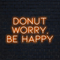 Colorful LED sign with Donnut Worry, Be Happy; blends neon quote art with whimsical light decor. Custom and handmade design.