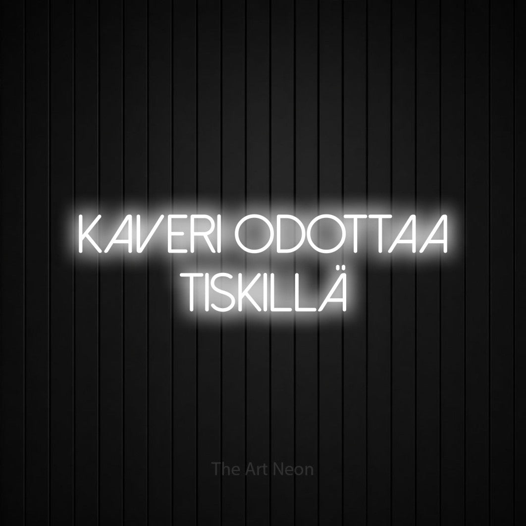 LED neon sign reading “Kaveri odottaa tiskillä”, arranged in 2 lines.