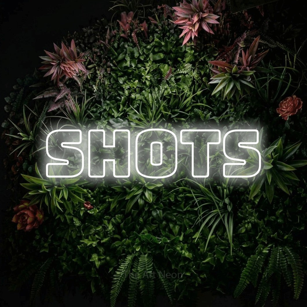 LED neon sign reading “Shots”, arranged in a single line.