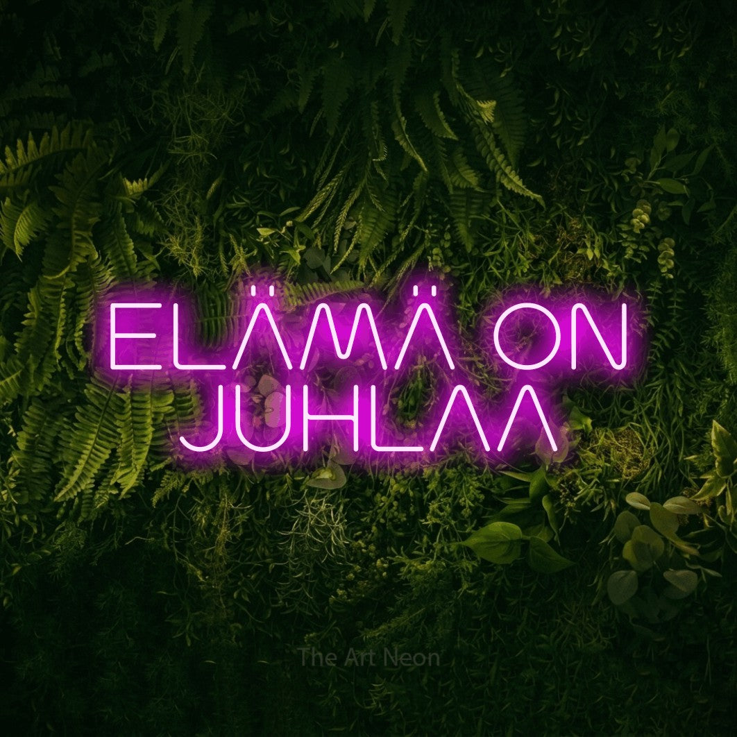 LED neon sign reading “ELÄMÄ ON JUHLAA”, arranged in 2 lines.