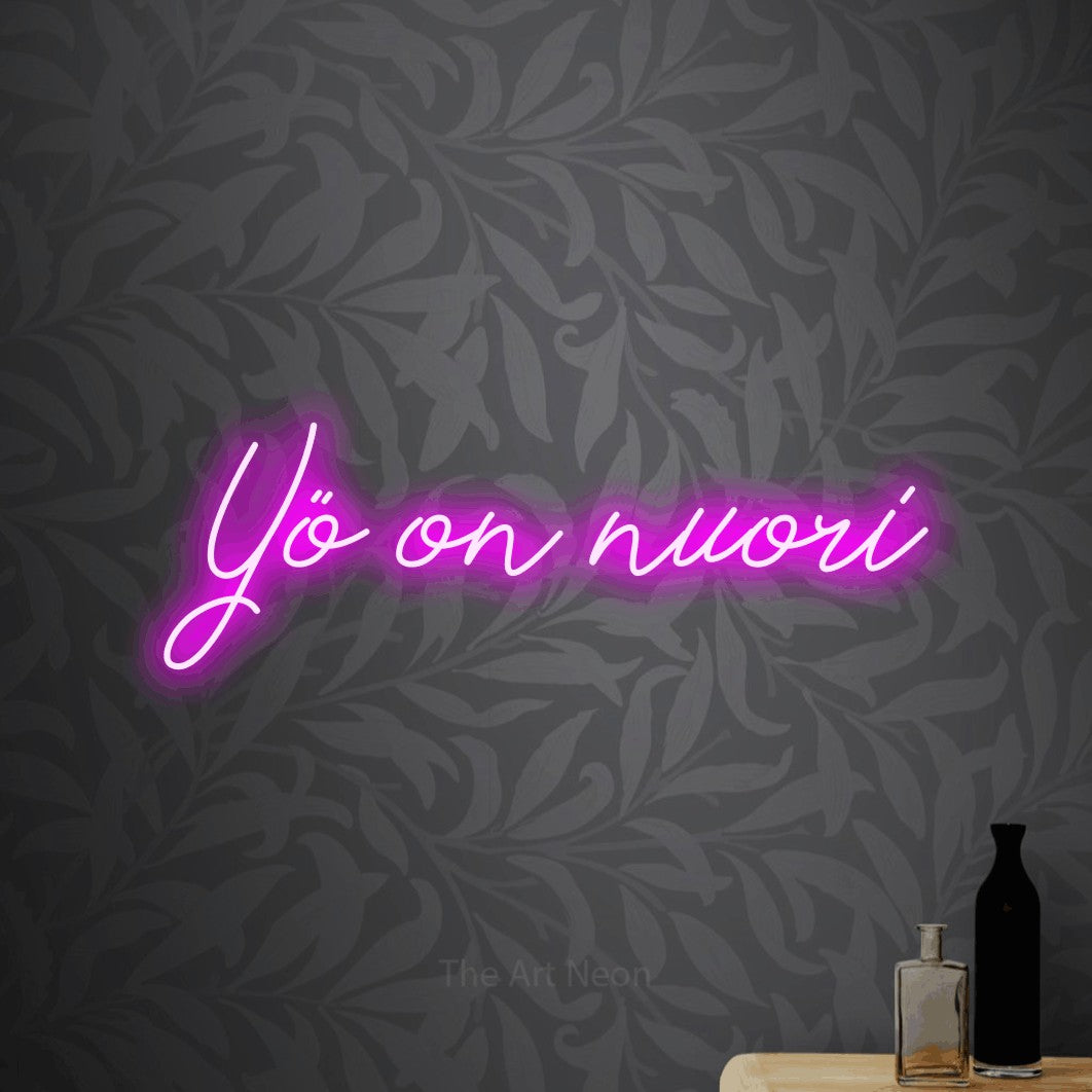 LED neon sign reading “Yö on nuori”, arranged in a single line.