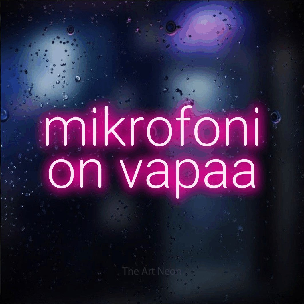 LED neon sign reading “mikrofoni on vapaa”, arranged in 2 lines.
