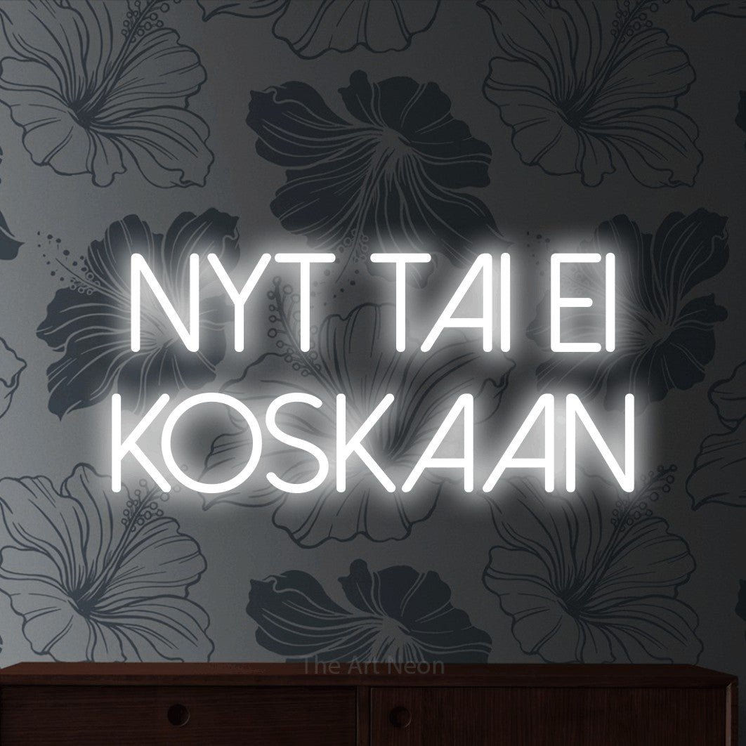 LED neon sign reading “nyt tai ei KOSKAAN”, arranged in 2 lines.