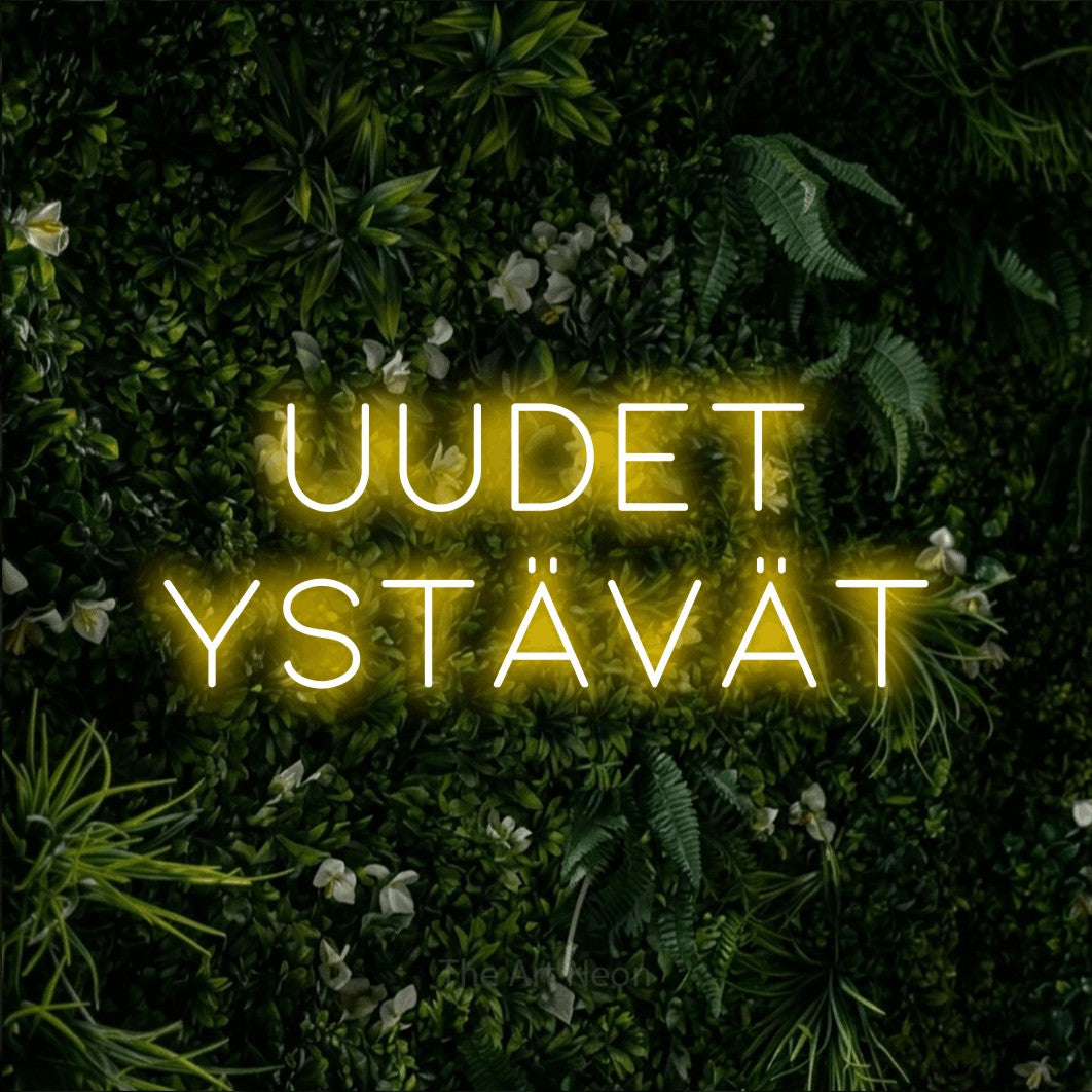 LED neon sign reading “Uudet ystävät”, arranged in 2 lines.
