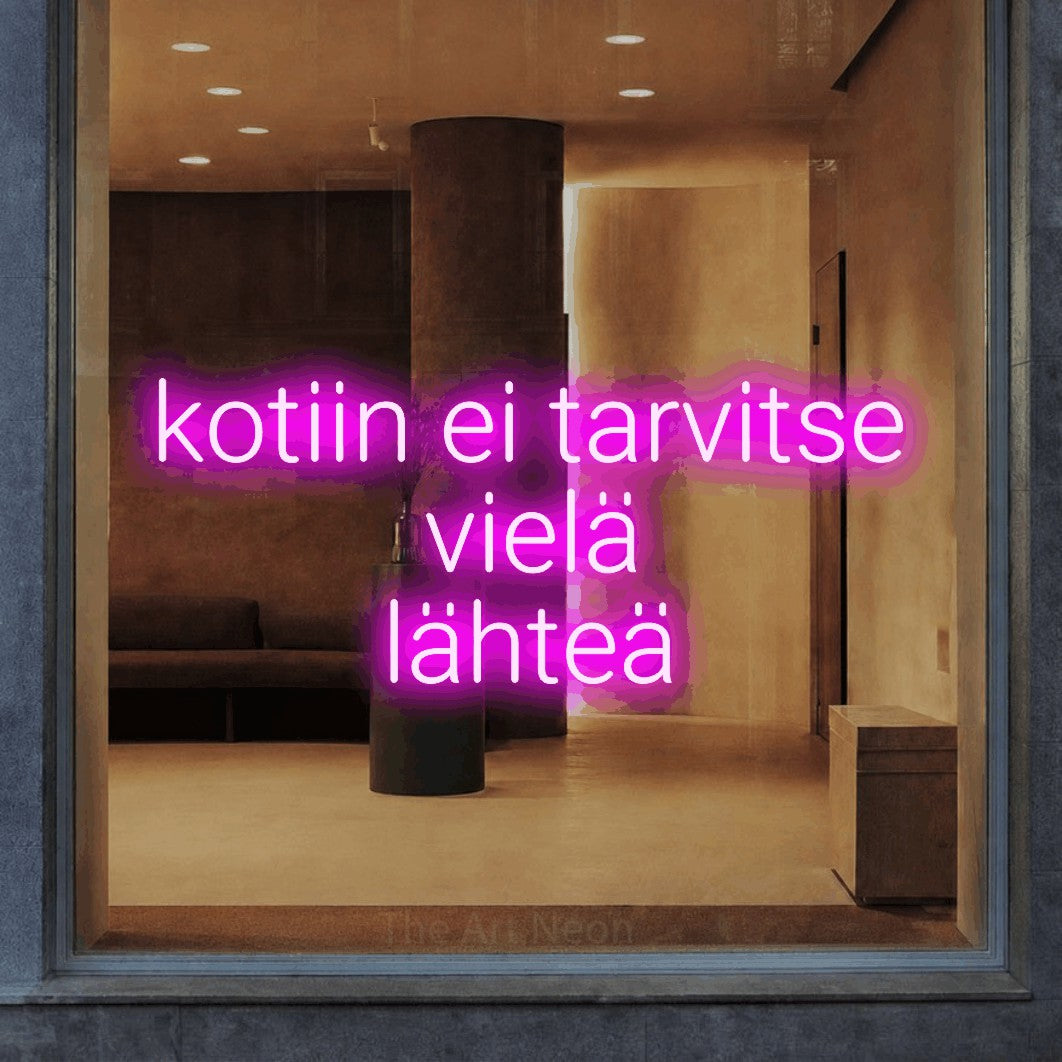 LED neon sign reading “kotiin ei tarvitse vielä lähteä”, arranged in 3 lines.