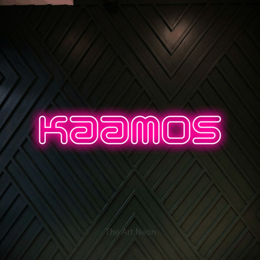 LED neon sign reading “Kaamos”, arranged in a single line.