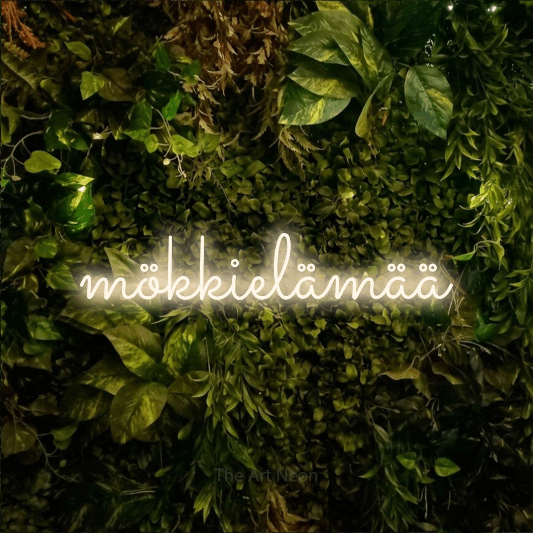 LED neon sign reading “mökkielämää”, arranged in a single line.