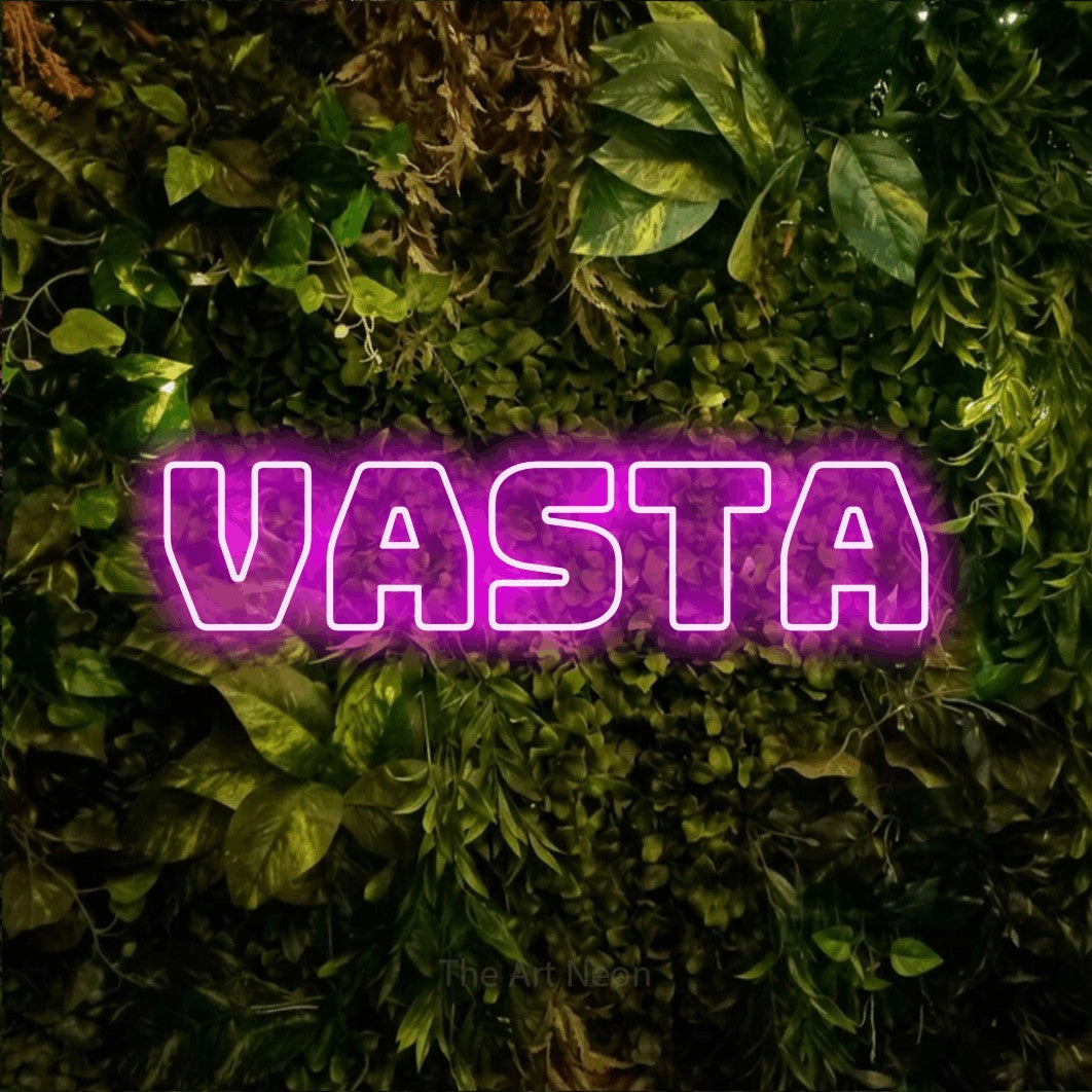 LED neon sign reading “Vasta”, arranged in a single line.
