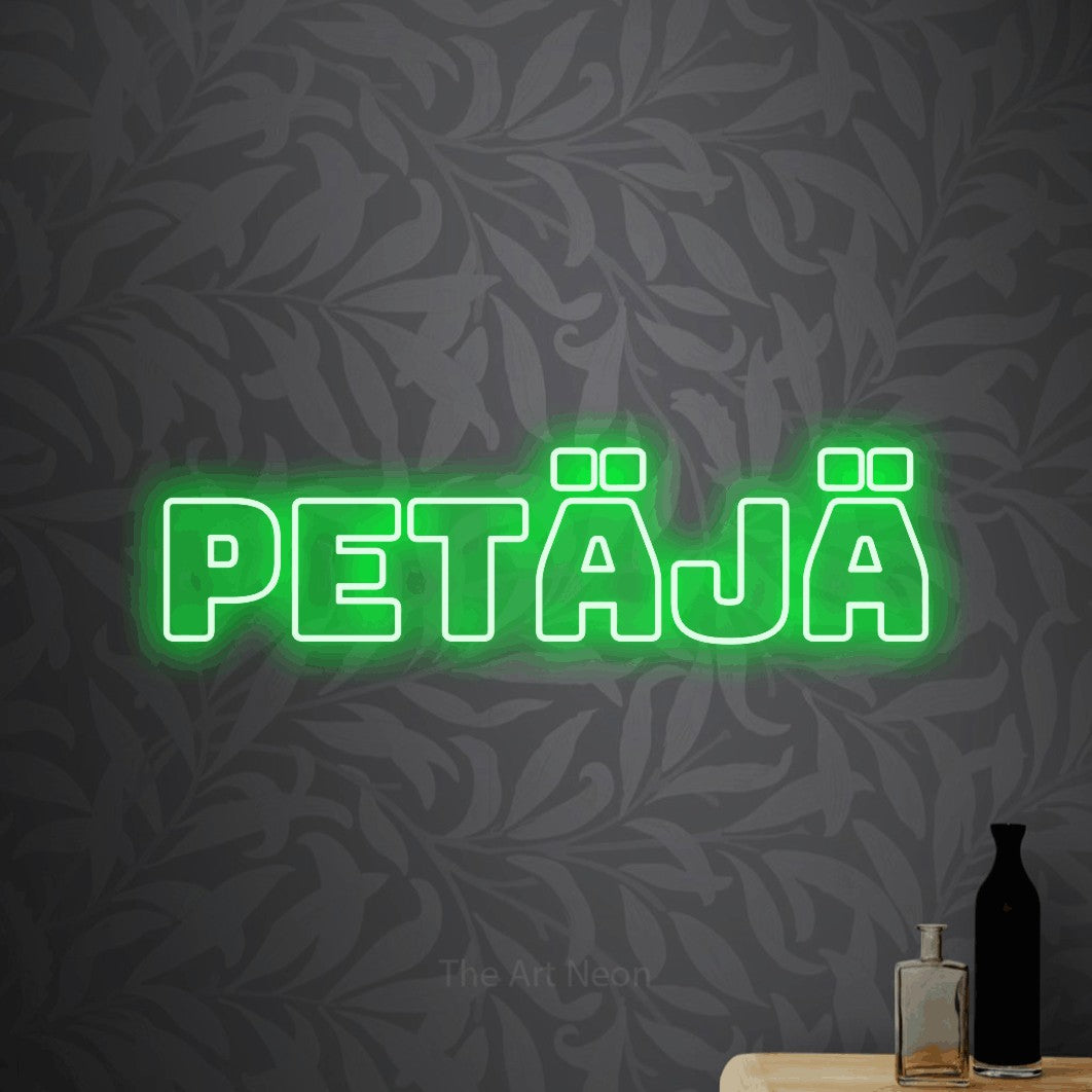 LED neon sign reading “Petäjä”, arranged in a single line.