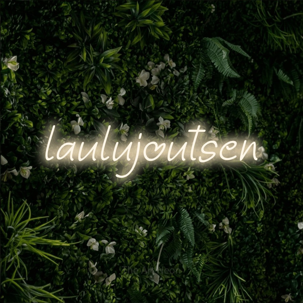LED neon sign reading “laulujoutsen”, arranged in a single line.