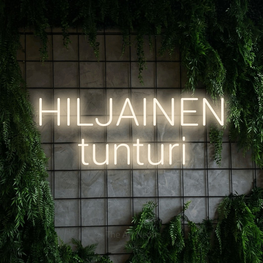 LED neon sign reading “HILJAINEN tunturi”, arranged in 2 lines.