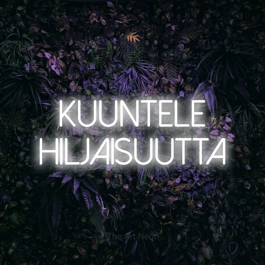 LED neon sign reading “Kuuntele hiljaisuutta”, arranged in 2 lines.