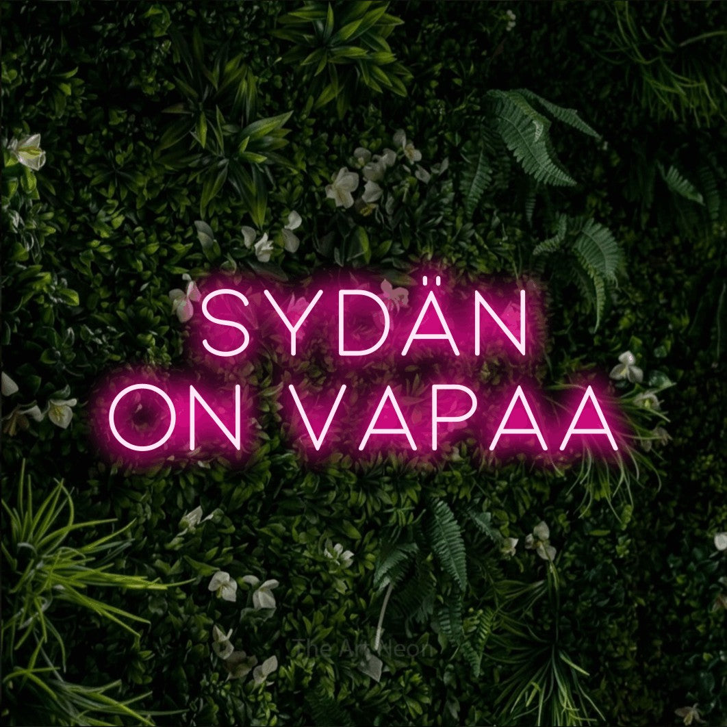 LED neon sign reading “sydän on vapaa”, arranged in 2 lines.